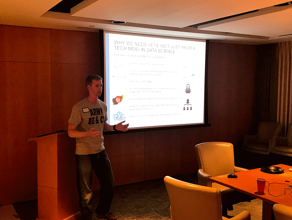 Animated GIF of Kristof Ladny presenting his talk on transitioning from Army Infantry to Data Science